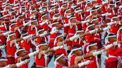 Muay Thai boxers perform the Wai Khru routine to set a Guinness World Record at a martial arts festival in Thailand. Reuters