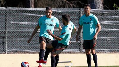 From left, Joao Palhinha, Bernardo Silva and Cristiano Ronaldo during training. EPA