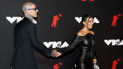 US musician Travis Barker and reality TV star Kourtney Kardashian, in Olivier Theyskens, arrive on the MTV Video Music Awards red carpet at the Barclays Centre in Brooklyn, New York on September 12, 2021. Photos: EPA