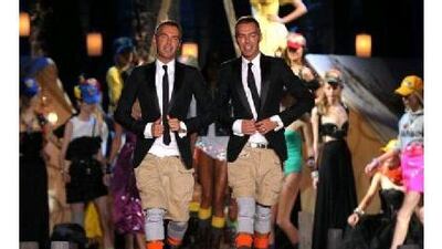 The designers Dan, left, and Dean Caten acknowledge the audience at the end of DSquared spring/summer 2010 ready-to-wear show last September during fashion week in Milan. Christophe Simon / AFP Photo