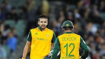 South Africans Quinton de Kock, near, and Rilee Rossouw, far, reach 100 for their partnership against Australia in a T20 international victory on Wednesday in Adelaide. David Mariuz / AFP / November 5, 2014