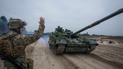 Ukrainian servicemembers take part in drills at a training ground in Ukraine. Reuters