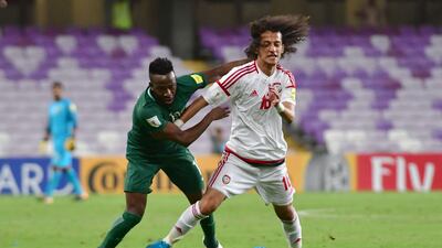 UAE's midfielder Mohamed Alraqi (R) fights for the ball with Saudi's forward Fhad al-Muwallad during the 2018 FIFA World Cup qualifier football match between UAE and Saudi Arabia at the Hazza Bin Zayed Stadium in Al-Ain on August 29, 2017. Giuseppe Cacace / AFP