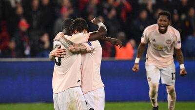 Manchester United's Brazilian midfielder Fred, and teammates Victor Lindelof, centre, and Romelu Lukaku celebrate after their 3-1 victory over Paris Saint-Germain in Paris sent United through to the Champions League quarter-finals on away goals. AFP