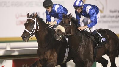 Derbaas and jockey Dane O’Neill, right, edged out War Monger and jockey Sam Hitchcott to win the National Day Cup Prep race Sunday night at Abu Dhabi Equestrian Club. Lee Hoagland / The National