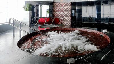 A three-bedroom penthouse at the Damac Maison tower, which comes with a private jacuzzi, is currently on the market for Dh14.8 million. Satish Kumar / The National