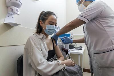 Covid-19 inoculations have started in Dubai for Chinese nationals, such as Xia Zining, left, at Al Safa Health Centre in Dubai on May 27th, 2021. Antonie Robertson / The National