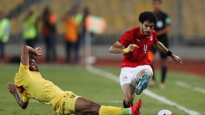 Guinea's Jose Kante in action with Egypt's Omar Gaber. Reuters