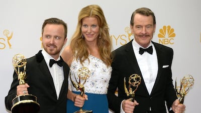 From left to right: Actors Aaron Paul, Anna Gunn and Bryan Cranston pose in the press room after winning the Outstanding Drama Series Award, Outstanding Lead Actor in a Drama Series Award, Outstanding Supporting Actor in a Drama Series Award and Outstanding Supporting Actress in a Drama Series for "Breaking Bad" during the 66th Emmy Awards, August 25, 2014 at the Nokia Theatre in downtown Los Angeles. Mark Ralston / AFP photo