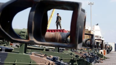 A Lebanese Army soldier stands near unloaded Howitzers, part of a military donation from the U.S. government to the Lebanese army, during a ceremony at Beirut's port, Lebanon. Mohamed Azakir / Reuters