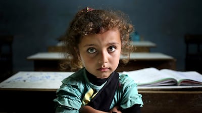 A Syrian refugee girl sits in a classroom at a Lebanese public school where only Syrian students attend classes in the afternoon, at Kaitaa village in north Lebanon. Hussein Malla / AP Photo / May 29, 2014