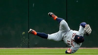 Tyler Collins #18 of the Detroit Tigers is unable to field a triple by Trayce Thompson #28 of the Chicago White Sox during the fourth inning at US Cellular Field in Chicago, Illinois. Jon Durr / Getty Images / AFP