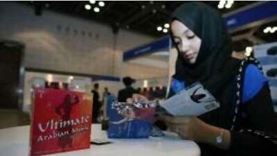 Music to the ears: Sana Hassan checks out music CDs at the booth of Getmo Arabia during the recent Gitex technology week held in Dubai.