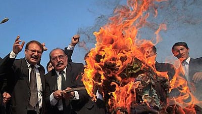 Pakistani lawyers burn an effigy of Barack Obama, the US president, in a protest in Peshawar following a Nato cross-boarder attack that killed 24 soldiers at the weekend.