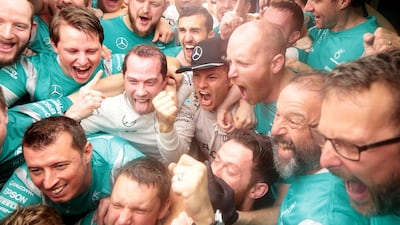 Nico Rosberg of Germany and Mercedes celebrates with his team after winning the world championship. Christopher Pike / The National