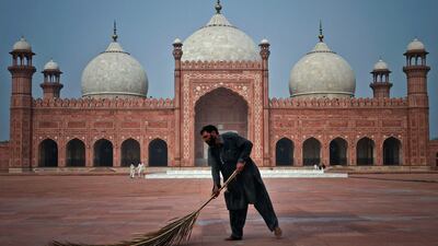 Sunday, July 31, 2011. Lahore, Pakistan. A Pakistani worker cleans the floor of a historical Badshahi mosque in preparation for Ramadan. AP Photo/K.M. Chaudary