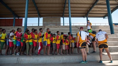 Junior players from the USI Ikopa team queue for Dubai Hurricanes kit at a tournament organised by the Air Seychelles Mike Ballard Foundation Conquistadors in Antananrivo. Photo by Rafalia Henitsoa
