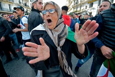 An Algerian woman chants slogans as she takes part in an anti-government demonstration in the capital Algiers. AFP