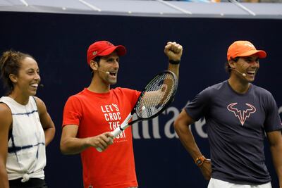 Novak Djokovic, centre, is aiming to win his third US Open title. EPA