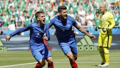 Didier Deschamps's decision to move Antoine Griezmann, left, up front with Olivier Giroud, right, paid dividends in the second half. Laurent Cipriani / AP Photo