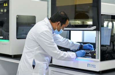 A researcher tests samples for the Emirati Genome Programme. Khushnum Bhandari / The National