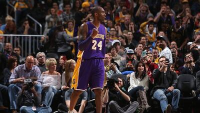 Kobe Bryant of the Los Angeles Lakers reacts during his team's NBA win over the Denver Nuggets on Tuesday night. Doug Pensinger / Getty Images / AFP / December 22, 2015