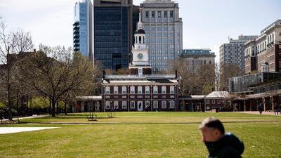 A pedestrian walks past the sparsely populated Independence Mall in Philadelphia on Monday. AP