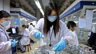 Technicians work in the high throughput purification laboratory at the WuXi PharmaTech facility in Wuxi, China.