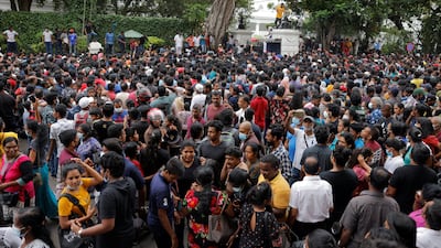 People wait to visit the presidential residence in Colombo after President Gotabaya Rajapaksa fled amid the country's economic turmoil. Reuters