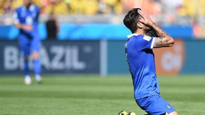 Greece midfielder Panagiotis Kone reacts after missing a goal opportunity during his side's loss to Colombia at the 2014 World Cup on Saturday. Eitan Abramovich / AFP