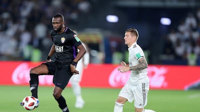 Toni Kroos of Real Madrid competes with Tongo Doumbia of Al Ain during the match between Real Madrid and Al Ain at the Fifa Club World Cup final the Zayed Sports City Stadium, Abu Dhabi. Chris Whiteoak / The National