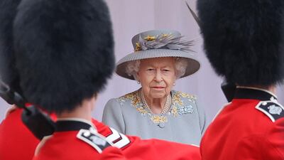 Queen Elizabeth II watches a military ceremony to mark her official birthday at Windsor Castle on June 12, 2021. AFP
