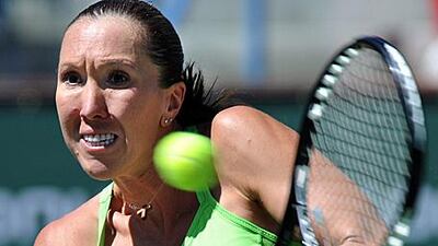 Serbia's Jelena Jankovic returns a shot to Samantha Stosur of Australia during their semi-final at Indian Wells yesterday.
