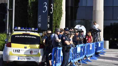 Police and media stand waiting for the arrival of Real Madrid's Portuguese forward Cristiano Ronaldo to appear at a court in Pozuelo de Alarcon. Gerard Julien / AFP
