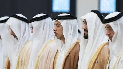 ABU DHABI, UNITED ARAB EMIRATES - June 04, 2019: HH Sheikh Mansour bin Zayed Al Nahyan, UAE Deputy Prime Minister and Minister of Presidential Affairs (3rd R), attends Eid Al Fitr prayers at the Sheikh Sultan bin Zayed the First mosque in Al Bateen. Seen with HH Sheikh Hazza bin Zayed Al Nahyan, Vice Chairman of the Abu Dhabi Executive Council (R) and HH Sheikh Nahyan Bin Zayed Al Nahyan, Chairman of the Board of Trustees of Zayed bin Sultan Al Nahyan Charitable and Humanitarian Foundation (2nd R). ( Rashed Al Mansoori / Ministry of Presidential Affairs ) ---