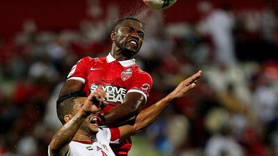 High heat and humidity make it easy for players such as Ismail Al Hammadi of Al Ahli and Mauricio Ramos of Sharjah to work up a sweat. Satish Kumar / The National