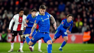 Grimsby Town's Gavan Holohan scoring his sides second goal from the penalty spot. PA
