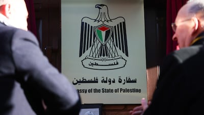 The plaque at the entrance to the embassy is unveiled. EPA