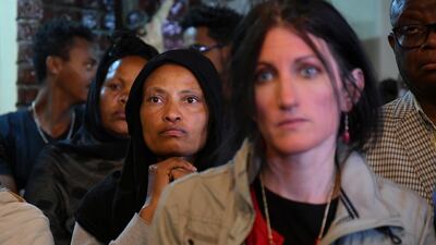 Relatives and mourners react as they attend a memorial at a Catholic church in Addis Ababa. EPA