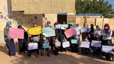 Students gather outside the entrance of one of the dormitory buildings in protest against the rape of one of their colleagues by an unknown man. The graffiti on the wall reads: 'A rape crime. A failed administration.' The placards read: 'The students of Hajjar dormitory demand justice.' Photo: Mosab Abdallah