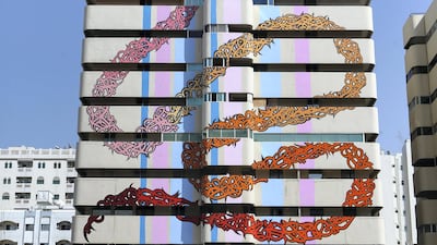 Street artist eL Seed painted an abandoned building on Bank Street as part of the new initiative by the Sharjah government to bring art into public places in February 2015. Sarah Dea / The National