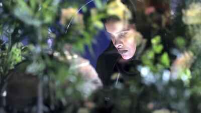 Moaza Matar smells a scent pod inside the pavilion. Chris Whiteoak / The National