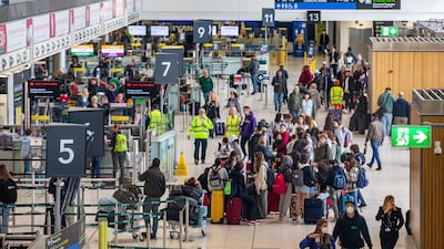 Passengers arrive at Dublin Airport on Friday morning as about 200,000 people were set to travel through its doors at the weekend. PA
