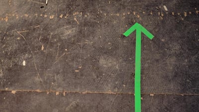 Green arrows help the performers navigate the darkened backstage area at the Bon Jovi concert. Delores Johnson / The National