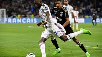 Lyon's Cameroonian forward Karl Toko Ekambi fights for the ball with Ajaccio's French forward Mounaim El Idrissy. AFP