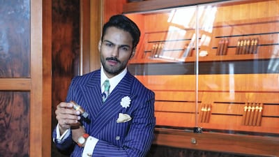 Abu Dhabi resident Jasim Ahmed enjoys splashing out on cigars and stylish clothes. Victor Besa / The National