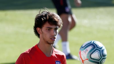 Joao Felix keeps an eye on the ball during training.