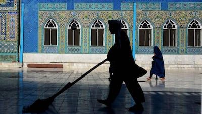 An Afghan resident sweeps the courtyard of the Hazrat-e-Ali shrine, or Blue Mosque, during the Islamic holy month of Ramadan in Mazar-i-Sharif. Farshad Usyan / AFP