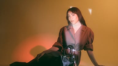 Single-breasted cotton canvas coat; leather belt; Galleria leather bag; Robot Saffiano leather key ring charm; and leather pumps, all from Prada. All photos: Ben Cope for TN Magazine