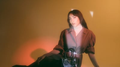 IN THE MOMENT: Sarah Taibah Photographer: Ben Cope at MMG Artists Fashion Director: Sarah Maisey Prada Single-Breasted Cotton Canvas Coat, Prada Leather Belt, Prada Galleria Leather Bag, Prada Robot Saffiano, Leather Key Ring Charm, Prada Leather Pumps